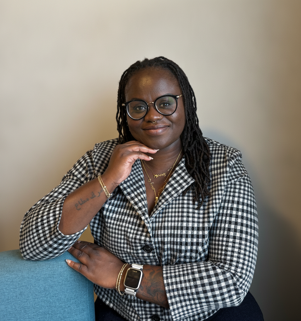 Sophia Okyere-Oduro, Registered Social Worker, seated on a teal couch